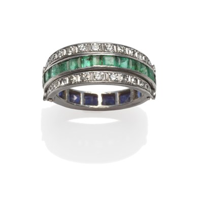 Lot 290 - An Emerald, Sapphire and Diamond Eternity 'Flip' Ring, the main band channel set with step cut...