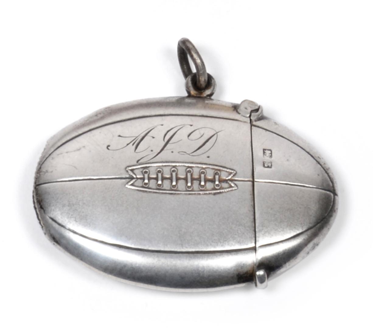 Lot 470 - An Edwardian Silver Vesta Case, Sampson Mordan & Co Ltd, Chester 1905, in the form of a rugby ball