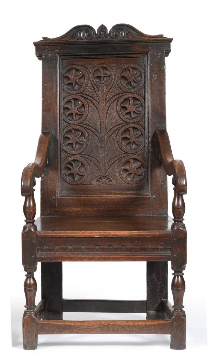 Lot 943 - An English 17th Century Joined Oak Wainscot Chair, the carved top rail above a tree of life...