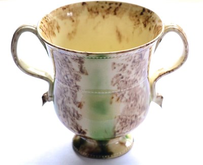 Lot 4 - An English Creamware Whieldon Type Double-Handled Cup, circa 1770, with three beaded strings...