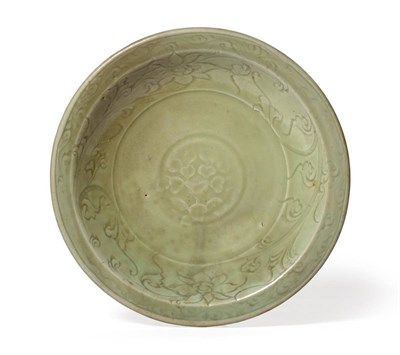 Lot 30 - A Chinese Longquan Celadon Dish, Ming Dynasty, probably 15th century, of circular form carved...