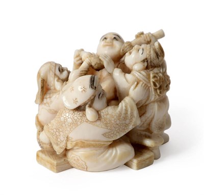 Lot 67 - A Japanese Ivory Netsuke, Meiji period (1868-1912), in the form of three conjoined scholars...
