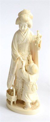 Lot 72 - A Late 19th Century Japanese Ivory Okimono, carved in the form of a maiden wearing traditional...