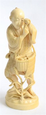 Lot 74 - A Japanese Ivory Okimono, Meiji period (1868-1912), depicting an egg seller, the peasant with a...