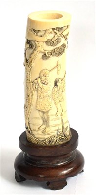 Lot 75 - A Japanese Ivory Carved Tusk Section, Meiji period (1868-1912), carved with a continuous scene...