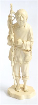Lot 76 - A Late 19th Century Japanese Ivory Okimono, depicting a fisherman holding a bamboo rod and...