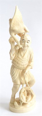 Lot 77 - A Late 19th Century Japanese Ivory Okimono, of a cormorant fisherman depicted with a cormorant...