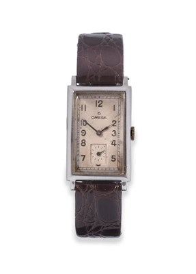 Lot 85 - A Stainless Steel Curved Wristwatch, signed Omega, circa 1942, lever movement numbered 9512803,...