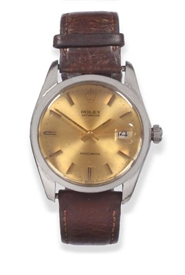 Lot 104 - A Stainless Steel Calendar Centre Seconds Wristwatch, signed Rolex, model: Oyster Date,...