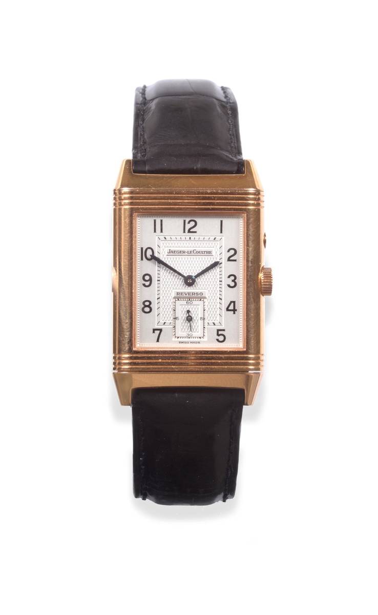 Lot 107 - An 18ct Gold Reversible Two Time Zone Day and Night Indications Wristwatch, signed Jaeger...