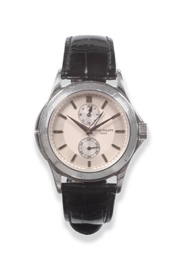 Lot 110 - A Fine Platinum Dual Time Zone Wristwatch with 24-hour Indication, signed Patek Philippe,...