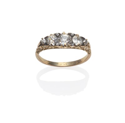 Lot 136 - An Early 20th Century Diamond Five Stone Ring, the graduated old cut diamonds spaced by pairs...