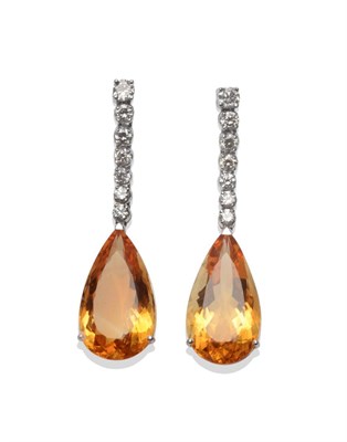 Lot 150 - A Pair of 18 Carat White Gold Citrine and Diamond Drop Earrings, a row of round brilliant cut...