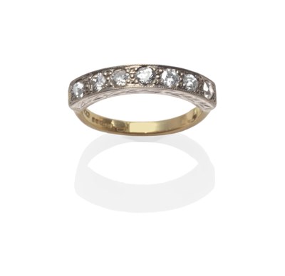 Lot 161 - An 18 Carat Gold Diamond Half Hoop Ring, seven old cut diamonds in white claw settings, on a...