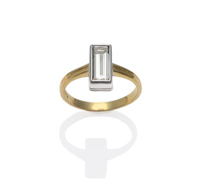 Lot 162 - An 18 Carat Gold Diamond Solitaire Ring, the baguette cut diamond in a white rubbed over...