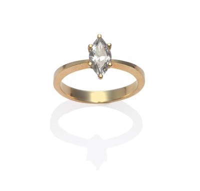 Lot 163 - A Diamond Solitaire Ring, the marquise cut diamond in a yellow claw setting, to a tapered...