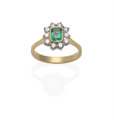 Lot 168 - An 18 Carat Gold Emerald and Diamond Cluster Ring, the emerald-cut emerald in a yellow rubbed...