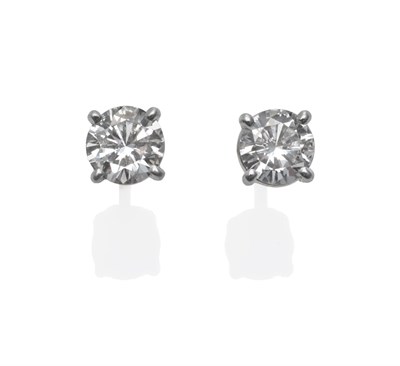 Lot 173 - A Pair of 18 Carat Gold Diamond Solitaire Earrings, round brilliant cut diamonds in white claw...