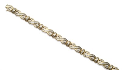 Lot 174 - A Diamond Set Bracelet, with figure-of-eight style links, inset with baguette cut diamonds, in...