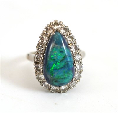 Lot 176 - A Mid 20th Century Black Opal and Diamond Cluster Ring, the pear shaped cabochon black opal...