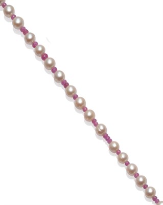 Lot 184 - A Pink Sapphire and Cultured Pearl Necklace, the slightly oval cultured pearls strung with...