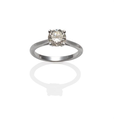 Lot 187 - An 18 Carat White Gold Diamond Solitaire Ring, a round brilliant cut diamond in a white four...