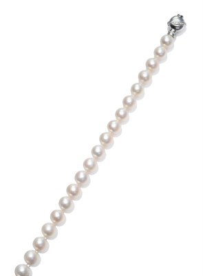 Lot 199 - A Cultured Pearl Necklace with Diamond Set Snap, the large cultured pearls knotted to a round...