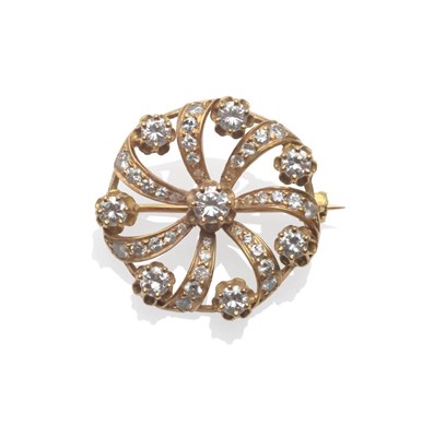 Lot 204 - A Diamond Brooch, inset with round brilliant cut diamonds in a swirl formation, in yellow claw...