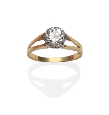 Lot 239 - An 18 Carat Gold Diamond Solitaire Ring, the old cut diamond in a white claw setting too yellow...