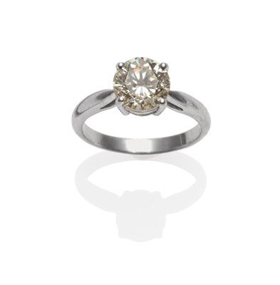 Lot 255 - A Platinum Diamond Solitaire Ring, the round brilliant cut diamond in a four claw setting, to a...