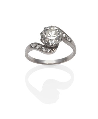 Lot 258 - An Early 20th Century Diamond Twist Ring, a round brilliant cut diamond in a white claw setting...