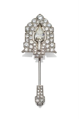 Lot 259 - An Art Deco Diamond Jabot Pin, by Cartier, the arrow head formed of a pear cut diamond in a pierced