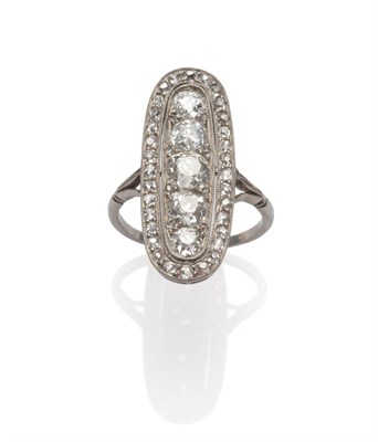 Lot 264 - An Art Deco Diamond Navette Cluster Ring, graduated old cut diamonds vertically set with pairs...