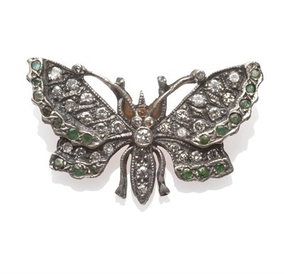 Lot 267 - A Diamond and Emerald Butterfly Brooch, set with brilliant cut diamonds throughout, with round...