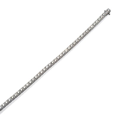 Lot 284 - A Diamond Line Bracelet, round brilliant cut diamonds in white claw squared settings, total...