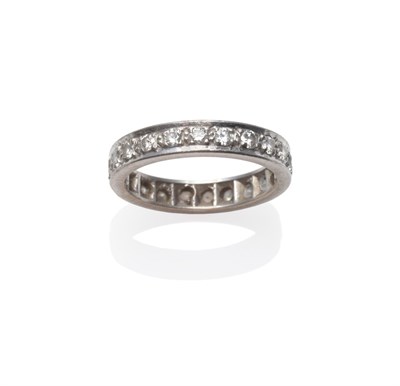 Lot 297 - A Diamond Eternity Ring, round brilliant cut diamonds in white claw settings, to a flat sided...