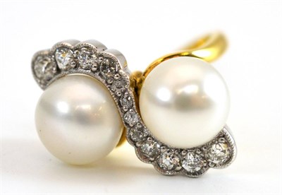 Lot 298 - An 18 Carat Gold Cultured Pearl and Diamond Ring, the two cultured pearls in a crossover style,...