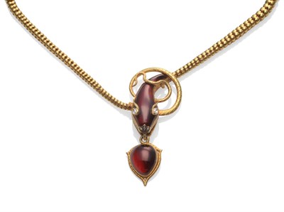 Lot 300 - A Snake Necklace, circa 1860, the body of fancy graduated links, to a head set with cabochon...