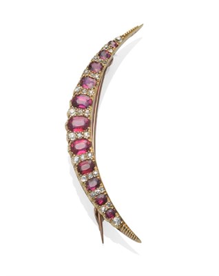 Lot 306 - A Ruby and Diamond Crescent Brooch, circa 1880, the graduated oval mixed cut rubies alternate...