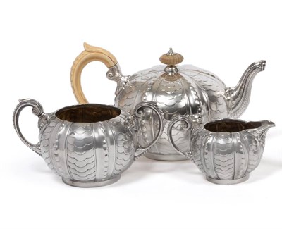 Lot 338 - A Victorian Silver Three Piece Tea Service, Frazer & Haws, London 1895, comprising teapot, milk jug