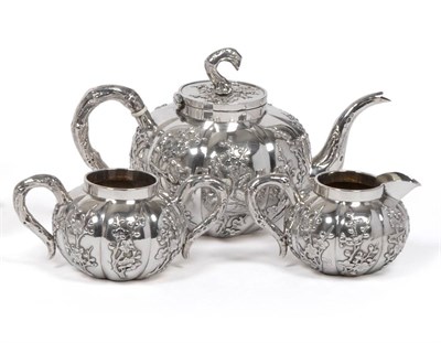 Lot 340 - A Chinese Export Silver Three Piece Tea Service, Hone Wo, Tai Ping Shan, Hong Kong, circa 1900,...