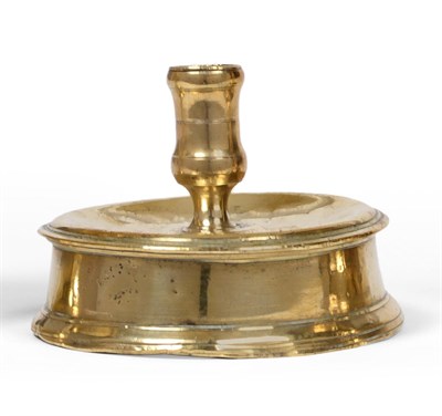 Lot 374 - A 17th Century Brass Drum or Reel Base Candlestick, probably Spanish circa 1650, with a shallow...