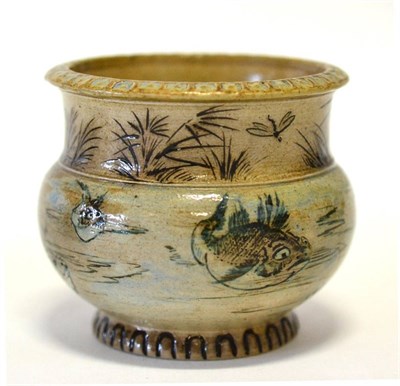 Lot 392 - A Martin Brothers Stoneware Plant Pot, incised with grotesque fish, reeds and dragonflies, in...