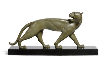 Lot 451 - An Art Deco Patinated Bronze Study of a Panther, circa 1925, in a green patina, on a black...