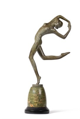 Lot 452 - An Art Deco Green Patinated Bronze Figure, modelled as a nude dancer, standing on one leg with arms