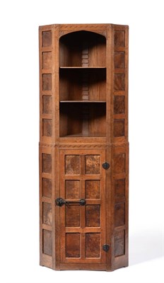 Lot 458 - A 1930's Robert  "Mouseman " Thompson Panelled Burr Oak Floor Standing Corner Cupboard, with...