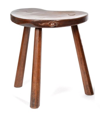 Lot 461 - A 1930's Robert  "Mouseman " Thompson Oak Kidney Cow Stool, on three octagonal legs, with...