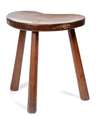 Lot 462 - A 1930's Robert  "Mouseman " Thompson Oak Kidney Cow Stool, on three octagonal legs, with...