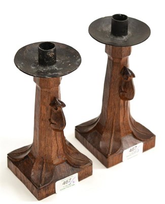 Lot 467 - A Pair of Robert  "Mouseman " Thompson Oak Candlesticks, with wrought-iron sconces, of...