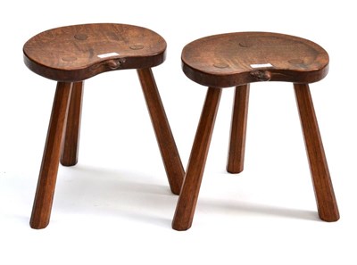 Lot 489 - A Pair of Robert  "Mouseman " Thompson Oak Calf Stools, the kidney shaped seats on three...